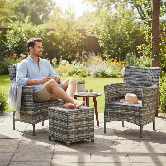 Gardenia Furniture grey rattan outdoor set with two armchairs, ottoman, and small table. Perfect for small patios.