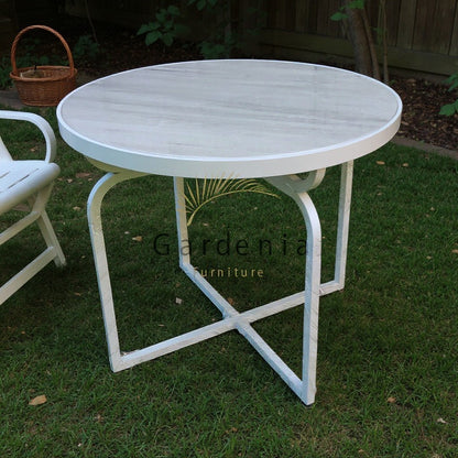Gardenia Furniture round marble top table with white aluminum frame, ideal for outdoor dining.