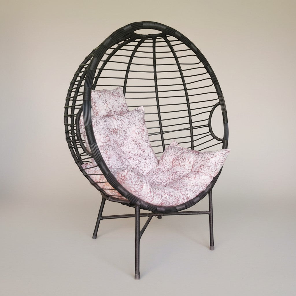 Gardenia Furniture Venicia egg-shaped rattan chair with pink patterned cushions, suitable for indoor/outdoor use.