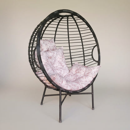 Gardenia Furniture Venicia egg-shaped rattan chair with pink patterned cushions, suitable for indoor/outdoor use.