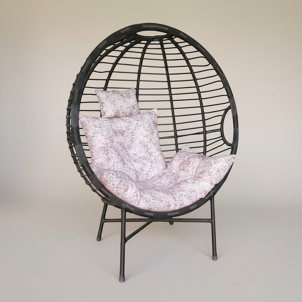 Gardenia Furniture Venicia egg-shaped rattan chair with pink floral cushions, suitable for indoor/outdoor use.