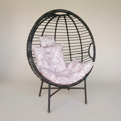 Gardenia Furniture Venicia egg-shaped rattan chair with pink floral cushions, suitable for indoor/outdoor use.