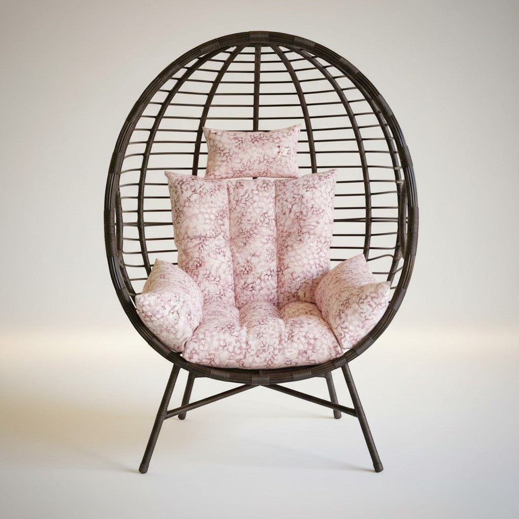 Gardenia Furniture Venicia egg-shaped rattan chair with pink floral cushions, suitable for indoor/outdoor use.